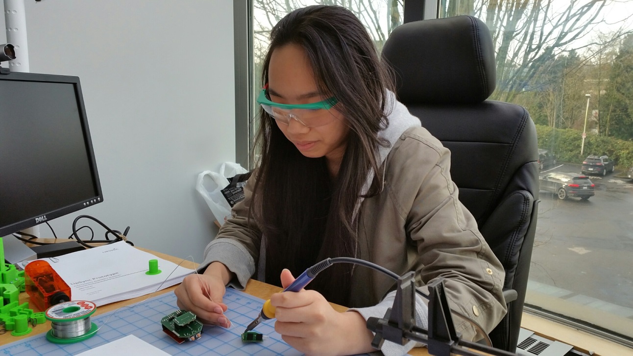 Kelly doing some soldering.