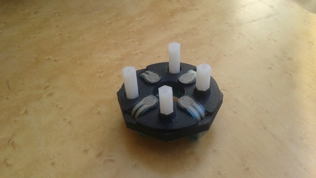 The bottom half of the joystick with the Force Sensitive Resistors (FSRs).