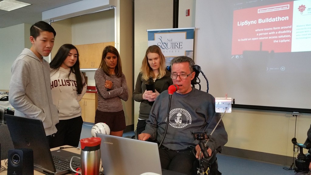 Jim using his LipSync. (The students who built his are the two on the left)