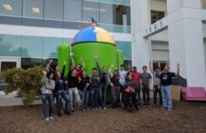 Google and Neil Squire Society staff pose in front of the Android statue at Google HQ