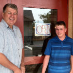 Cody standing with Roch Fortin outside the Maple Roch store. Photo via Summerland Review