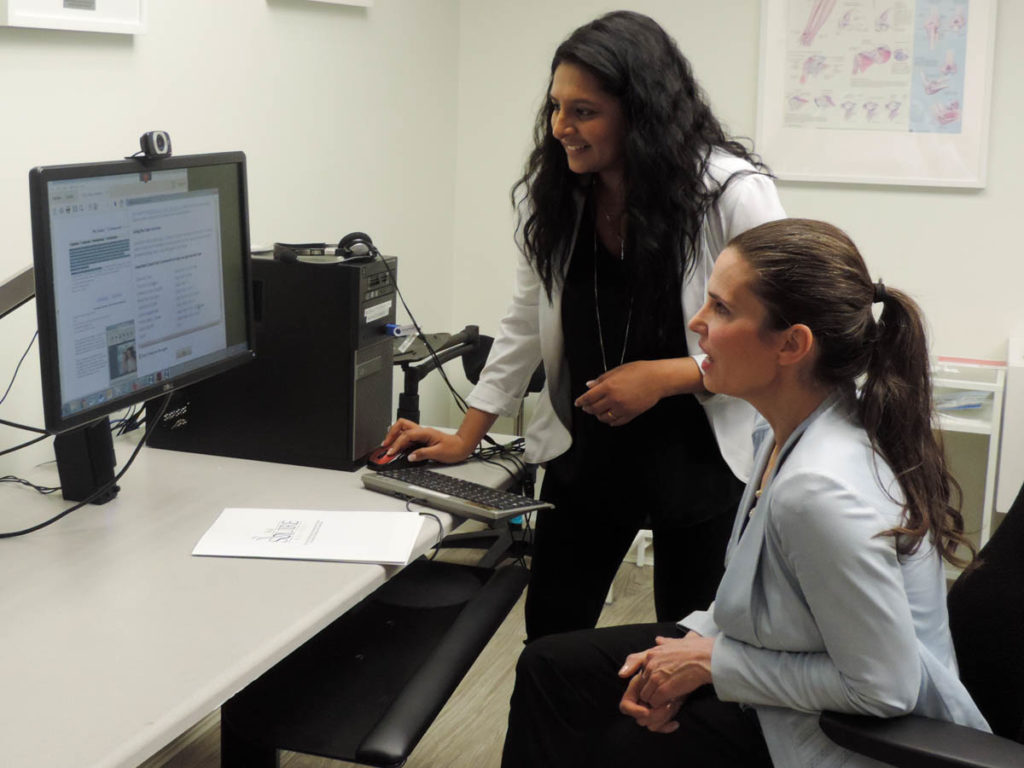 Piriya showcasing some computer-based assistive technologies to Minister Duncan