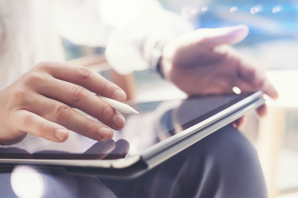 Person using a tablet with stylus