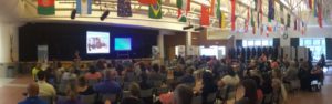 People seated, listening to presenter