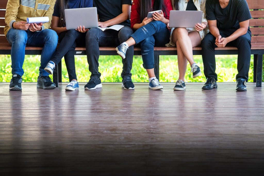 students sitting on a bench