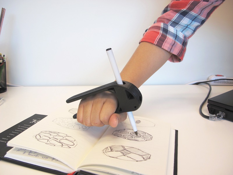 A demonstration of a palm pen holder