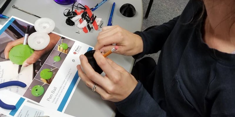 person assembling a pen ball