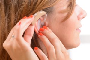 a woman with a hearing aid