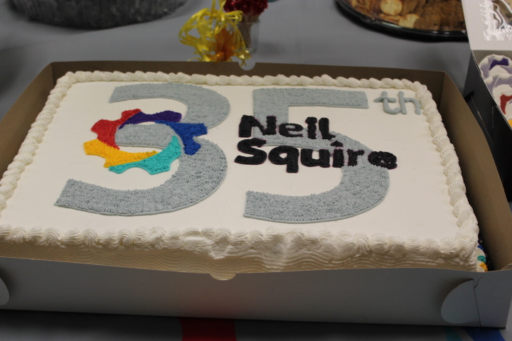 Cake with Neil Squire logo and the number 35