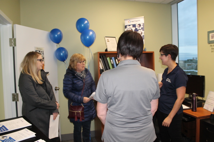 Staff speaking with attendees