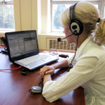 An intern using a headset for one of our virtual platforms in 2011