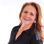 stock image of woman wearing silver earrings