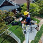 stock image of man repairing electrical wires