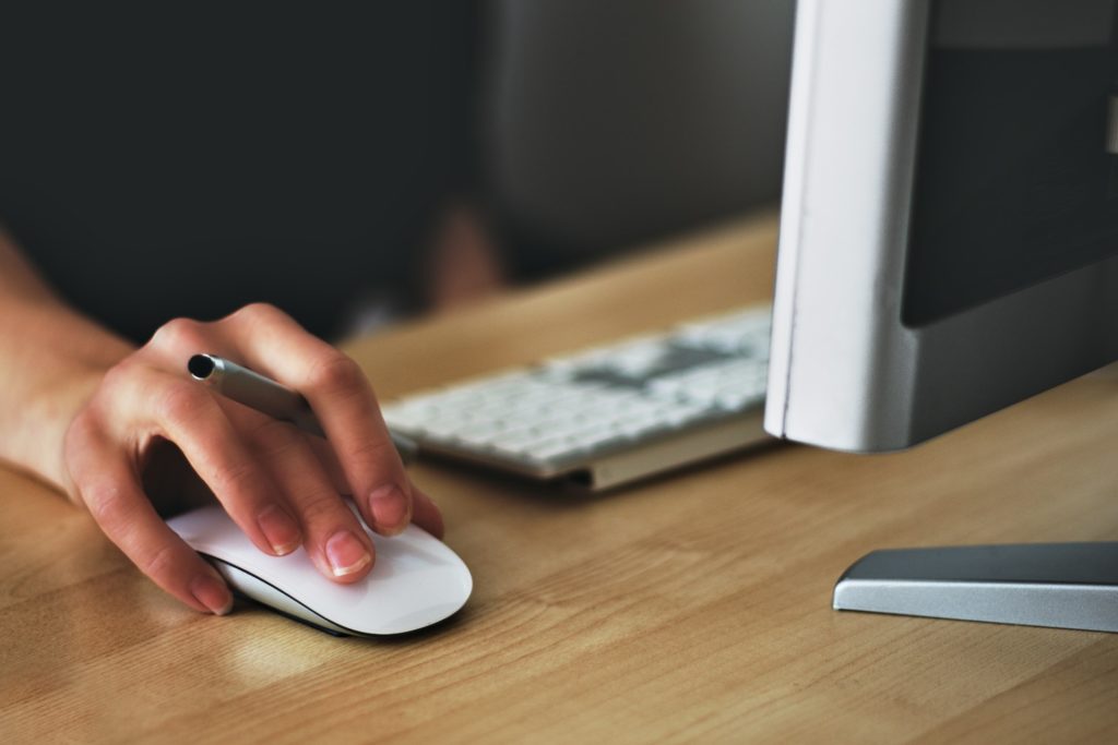 close-up of person's hand using a mouse