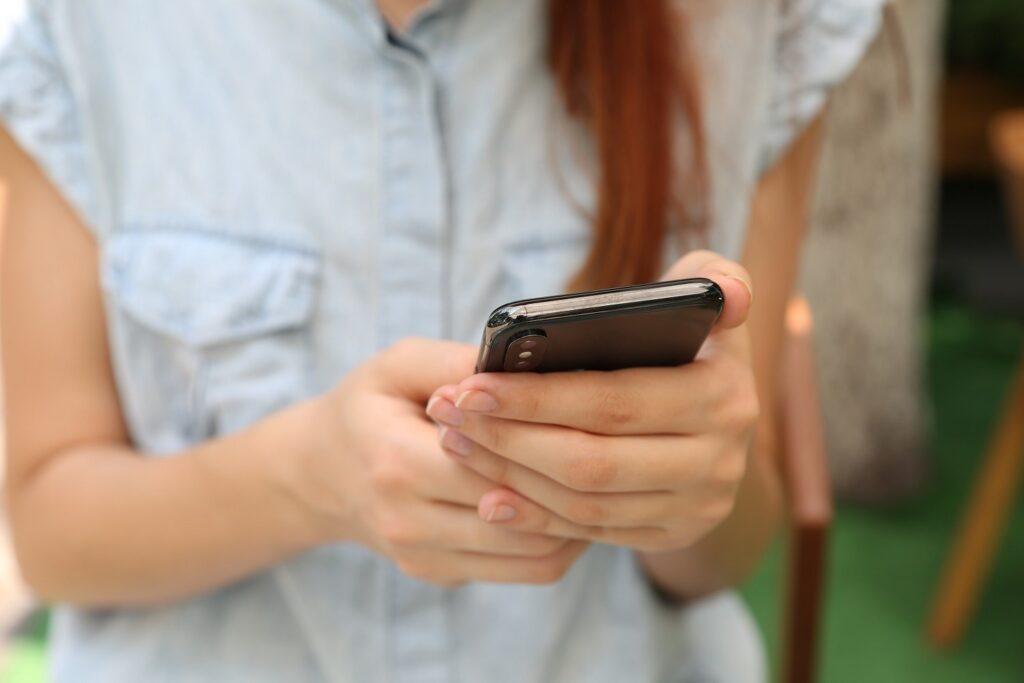 Close-up of person's hands using a smartphone