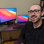 Nate at his desk with his new setup