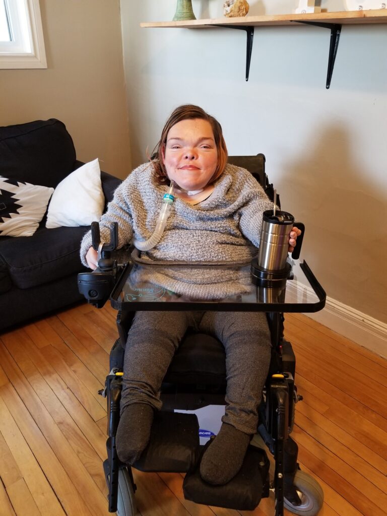 Bonnie using her wheelchair lap tray.