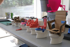 Tiny Toilets lined in a row.