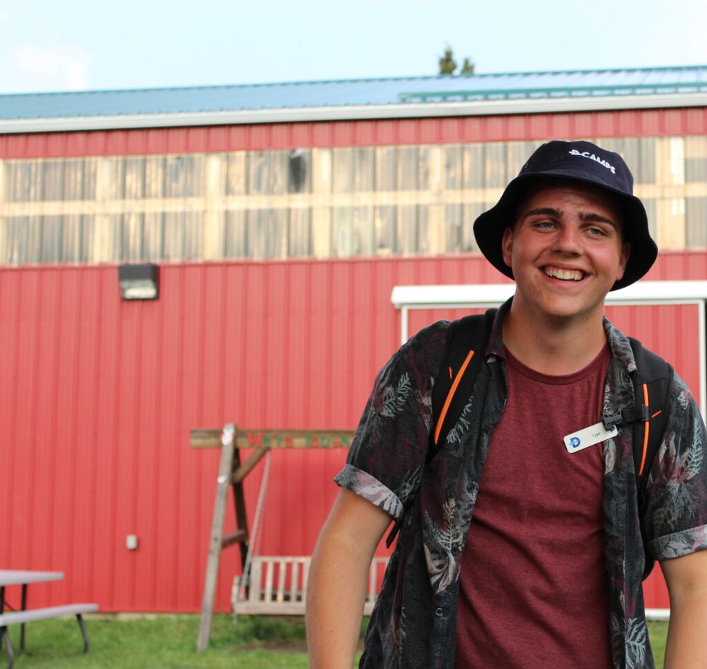 Tyler Fentie smiling in front of a building