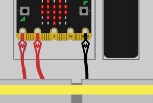 A graphic of red and black alligator clips on a Microbit