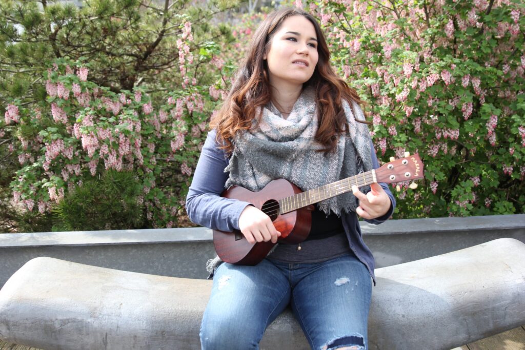 Kirstina Sheldon playing a ukulele