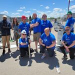 Neil Squire Prairie Region employees standing posing together wearing 