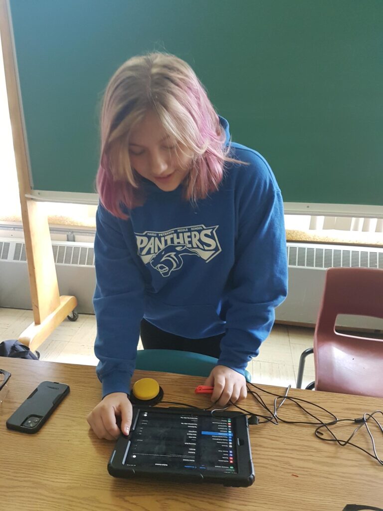 a student at Harold Peterson tests out some switches