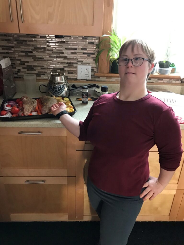 Working Together participant Rebecca preparing a meal in a kitchen