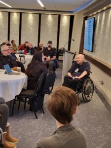 Executive Director Gary Birch speaks with attendants at the BC SCI Network event