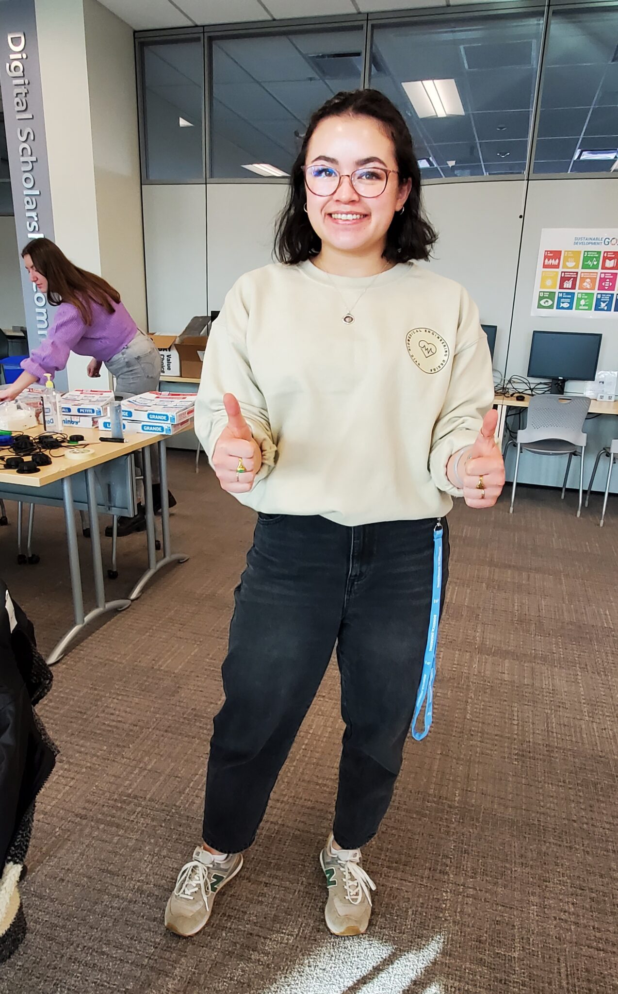 a student giving a thumbs up at the build event