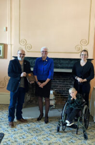 Charles Levasseur accepting the award from Lieutenant Governor Brenda Murphy and Easter Seals New Brunswick ambassador Jackson