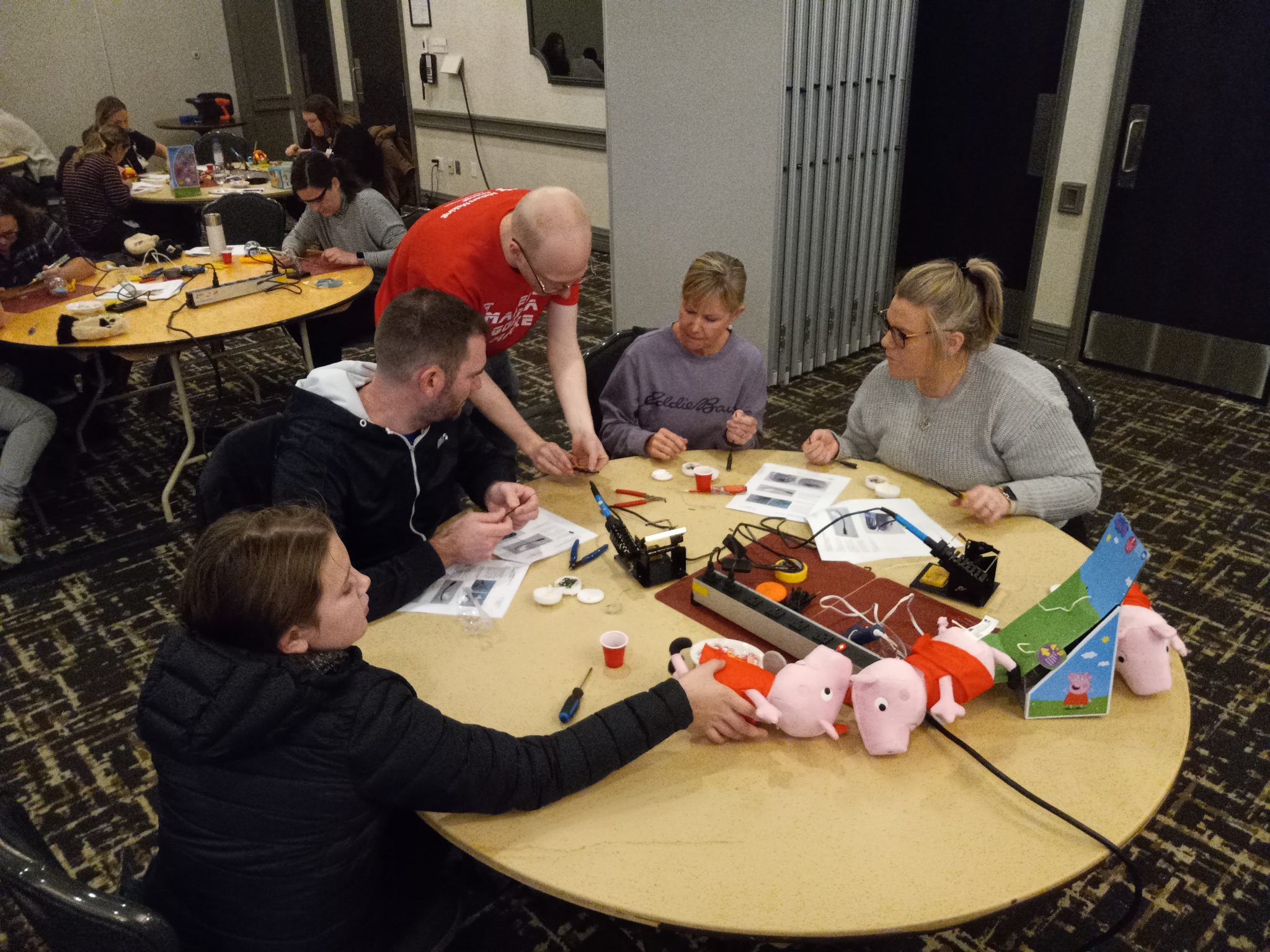 Makers Making Change volunteers adapting Peppa Pig toys