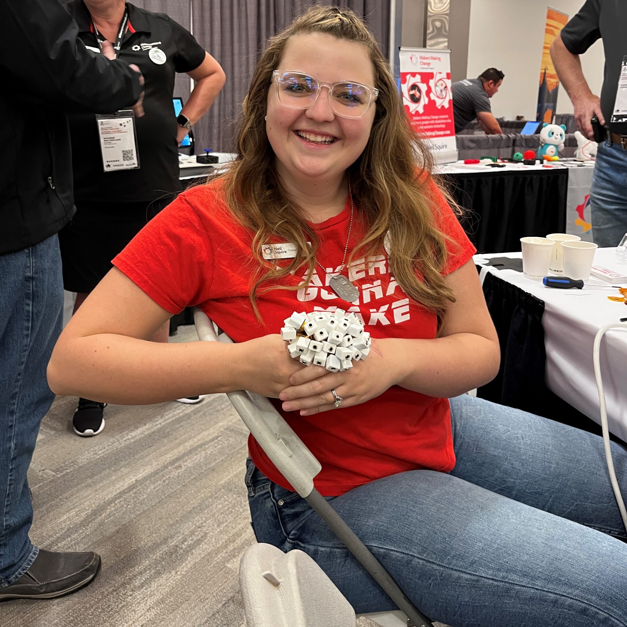 Makers Making Change West Region Coordinator Shanelle holding a bouquet of Battery Interrupters.