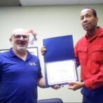 Alain presents Charles with the CAOT Citation Award.