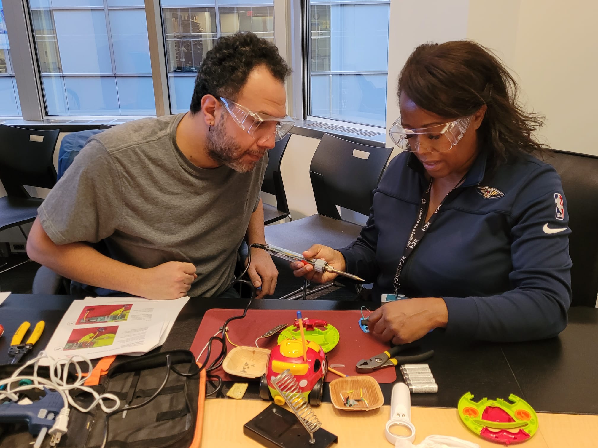 HDR employees work on a toy.