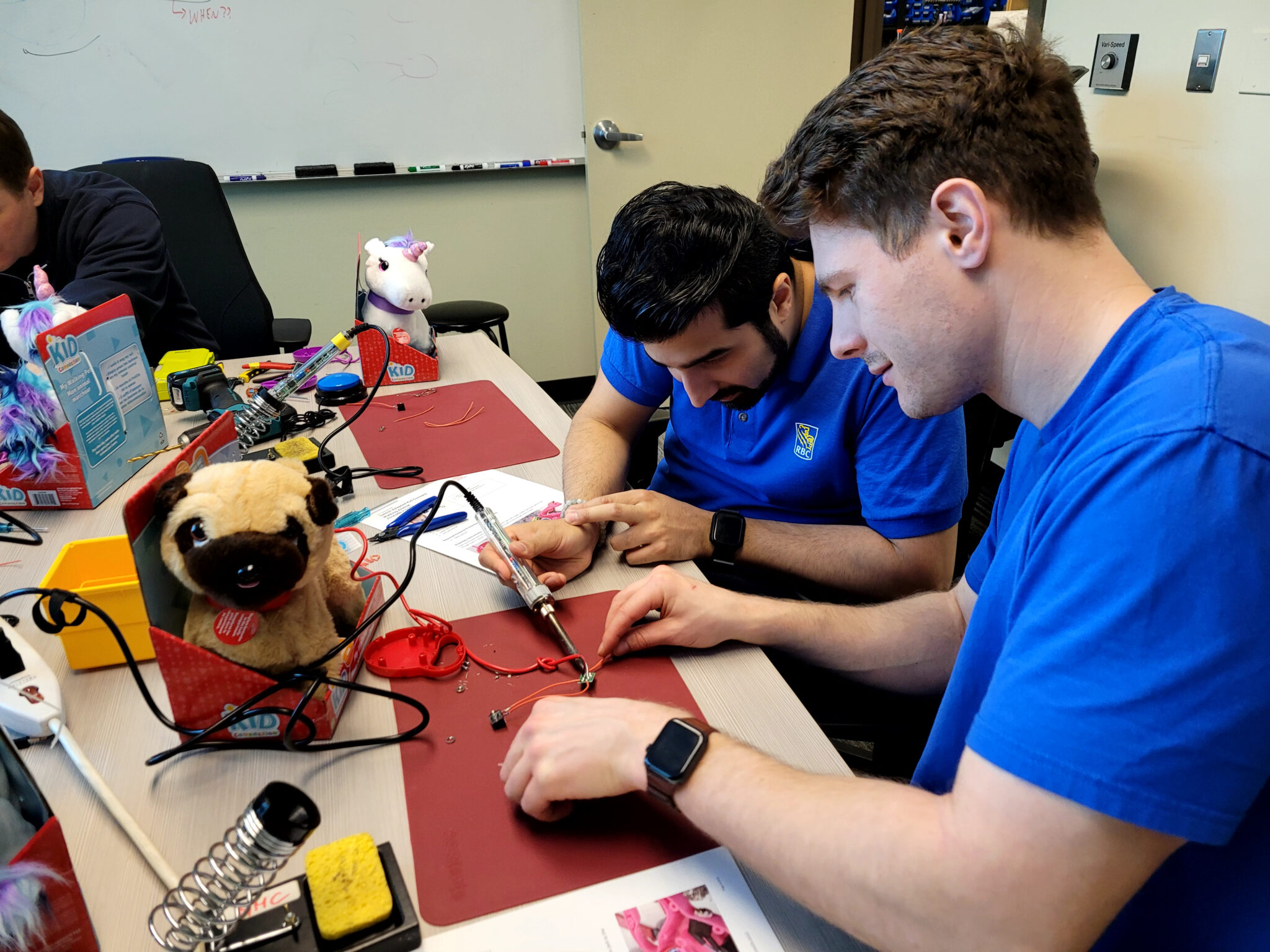 RBC employees adapting a toy.