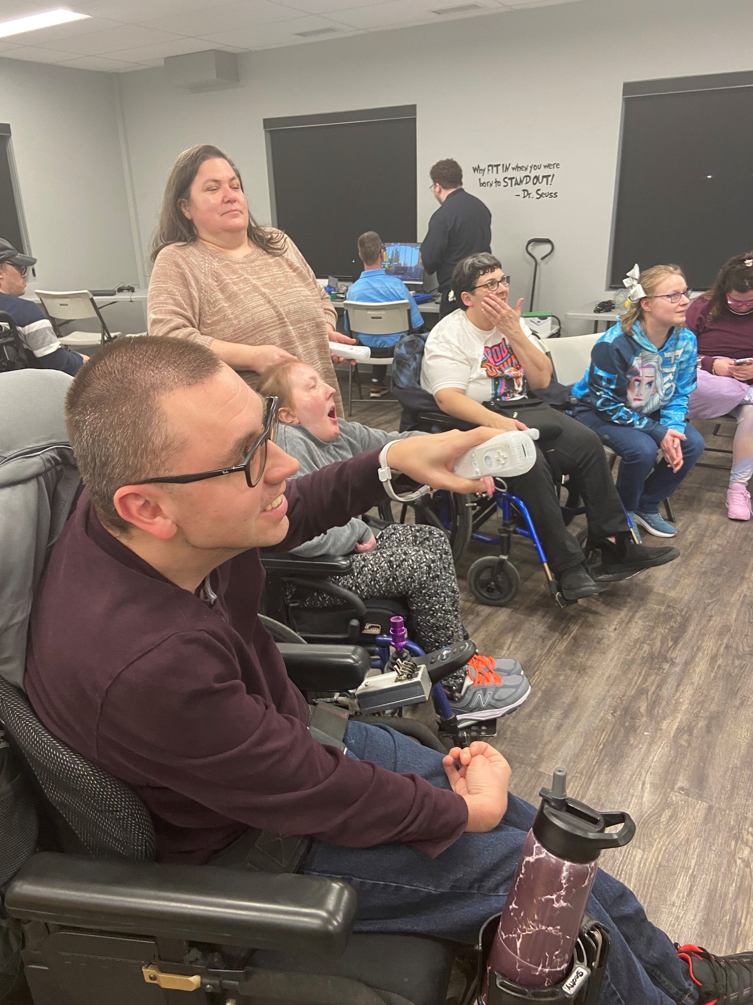 Participants playing games together at an Adaptive Gaming event with Cerebral Palsy Alberta.