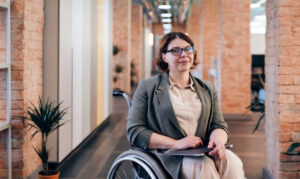 A woman in a wheelchair.