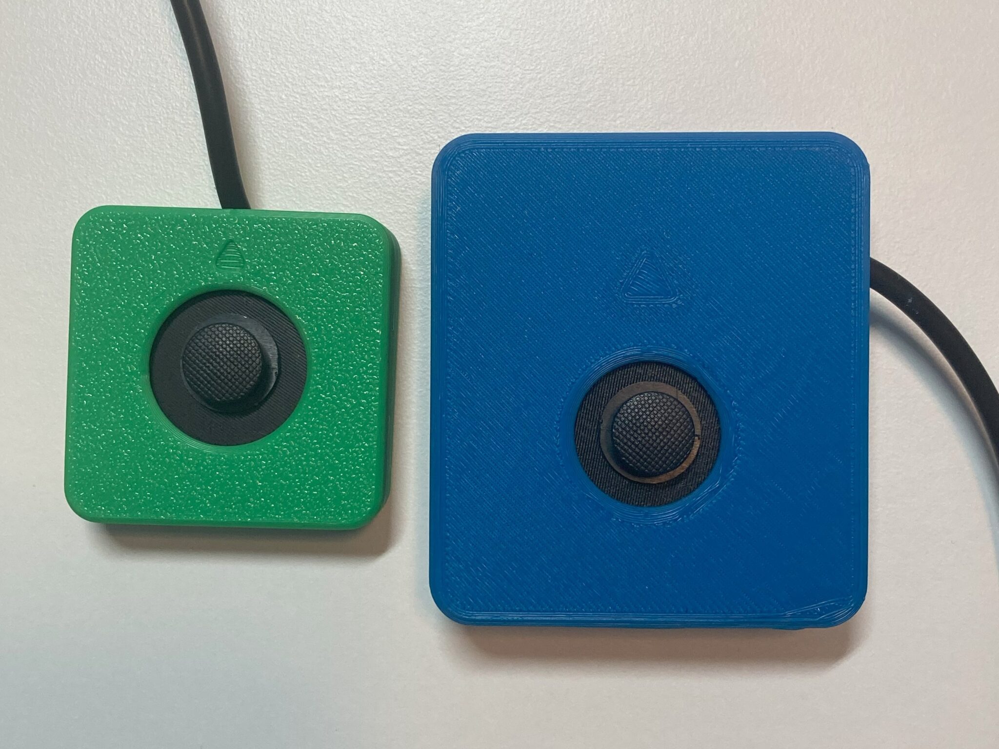 An Aspen Sliding Joystick in comparison to the Birch Sliding USB Joystick.