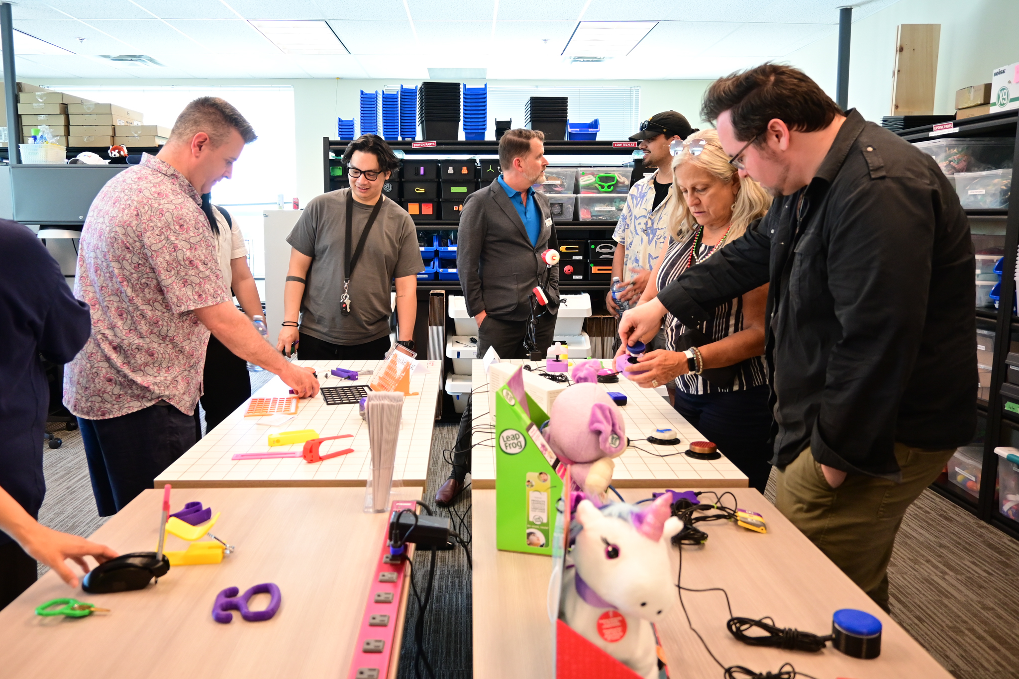 People touring the Makers Making Change office at the Neil Squire head office in Burnaby