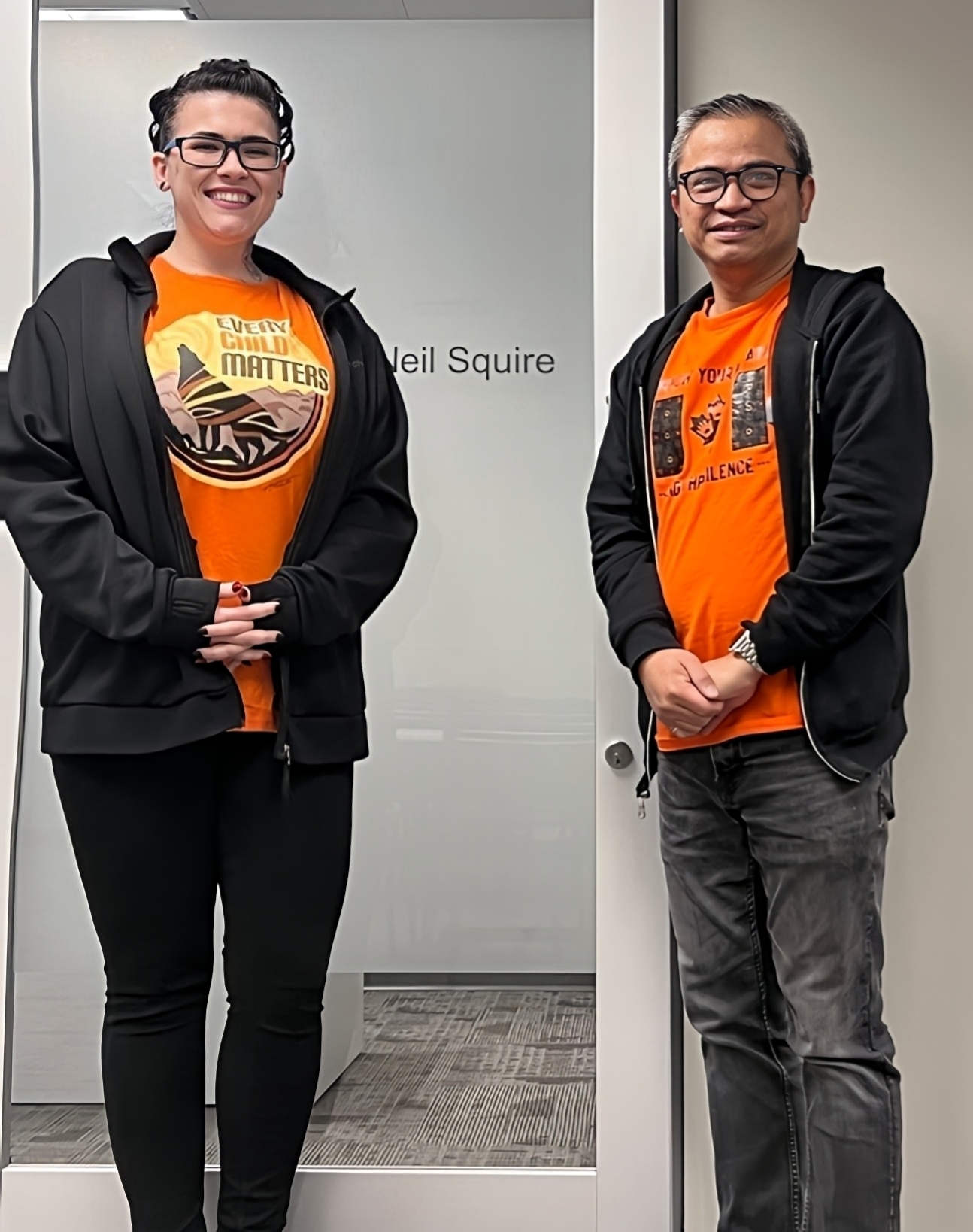 Our Calgary office wearing orange shirts