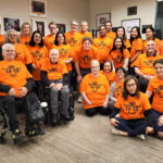 Neil Squire Burnaby office wearing orange shirts