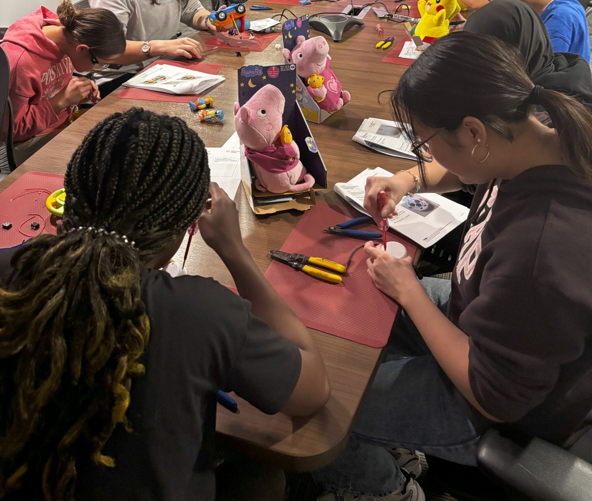 Youth Central volunteers work on adapting toys at a recent build event.