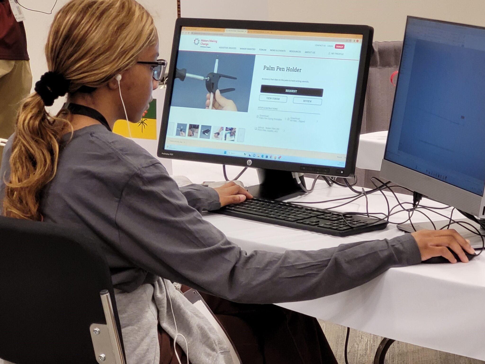 A student accesses a Makers Making Change assistive technology design on the computer