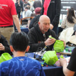 Volunteer makers work on devices at the Holiday Hackathon in November.